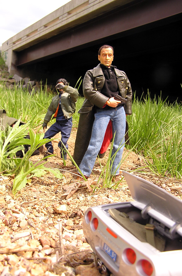 Action figures depicting Mike Caffee and Pete under a bridge